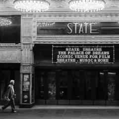 Man walks in front of State Theatre, Sydney, Australia